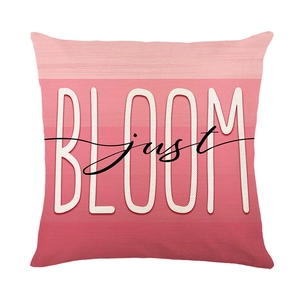 Fodera per cuscino moderna sfumata rosa con scritta BLOOM bianca per divano casa