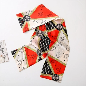 Detail of silk-like neck scarf with geometric patterns and houndstooth print design