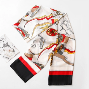 Detail of nautical print scarf featuring anchors and chains with elegant silk-like texture