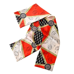S-shaped folded silk scarf with geometric star patterns and multi-color block prints
