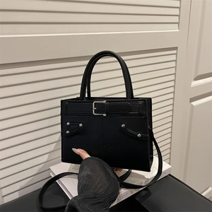 Minimalist large capacity black shoulder bag with chain detail and silver metal studs
