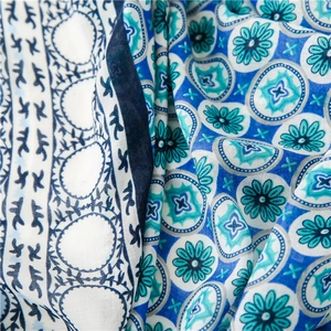 Macro shot of Bohemian mandala floral print on soft cotton-linen blend fabric texture