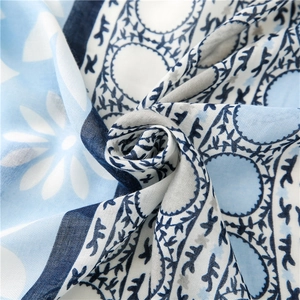 Blue and white floral print cotton linen shawl with abstract sun patterns