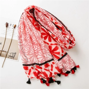 Artistic red and white floral cotton-linen scarf with elegant tassels on white background