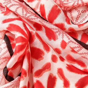 Detail of red floral and polka dot patterns on soft breathable cotton-linen fabric