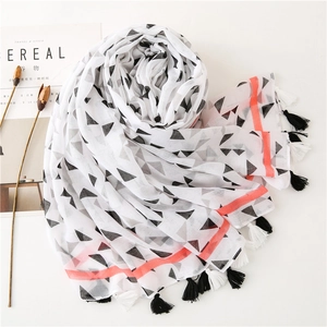 Women's white geometric scarf with black triangles and orange stripes and tassels