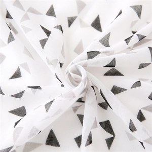 Breathable white scarf with black geometric triangle patterns in a swirl display
