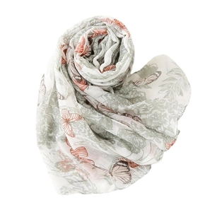 Floral butterfly scarf in linen-feel fabric with orange butterflies and green leaves