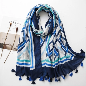 Bohemian geometric kaleidoscope scarf with tassel edges on a minimalist background