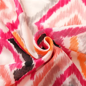 Macro shot of colorful geometric pattern and soft woven texture of the cotton linen scarf