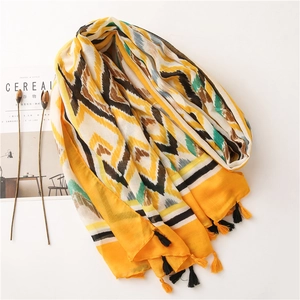 Detailed close-up of Bohemian cotton linen scarf with colorful wave patterns and fringe edge