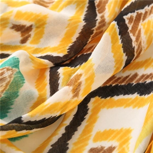 Macro shot of colorful zigzag geometric print on lightweight cotton linen scarf fabric
