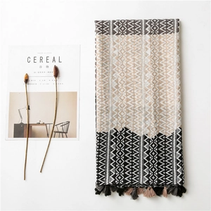 Bohemian geometric pattern long shawl with colorful tassels on a white background
