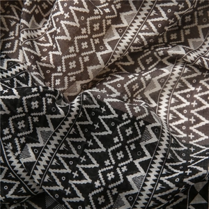 Detailed macro view of ethnic geometric pattern on woven cotton linen shawl fabric