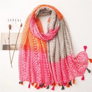 Detail of multi-color geometric cotton linen shawl with stylish fringe tassels