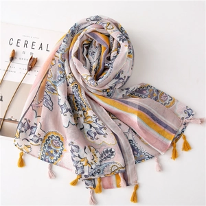 Bohemian paisley print scarf in pink and blue with elegant tassels on white background