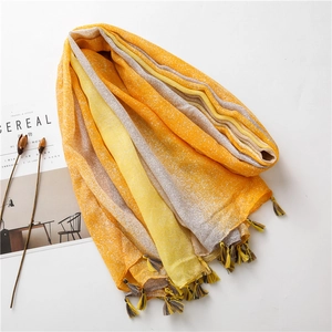 Close-up of lightweight gradient cotton scarf with fringe and ink-wash texture