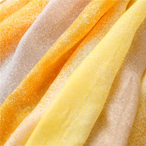 Macro view of light cotton linen scarf showing yellow and orange gradient starlight pattern