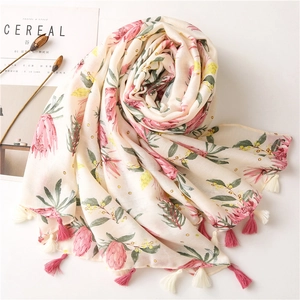 Floral print cotton linen scarf for women with pink blossoms and elegant fringe tassels