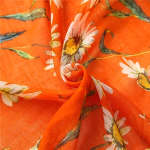 Bohemian orange cotton scarf with daisy print and soft frayed edges for women