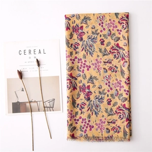 Floral cotton linen scarf in yellow with retro flower print and frayed edges for women