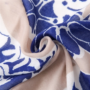 Macro shot of abstract floral print on soft blue and beige linen-feel fabric