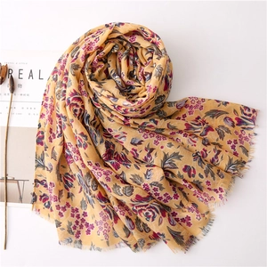 Floral print lightweight scarf in ginger yellow with small red flowers and frayed edges