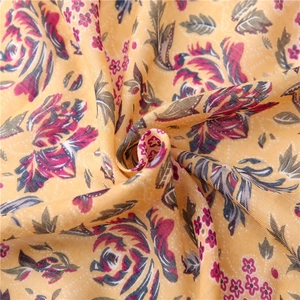 Floral print cotton linen scarf with large pink flowers on a warm yellow background