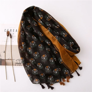 Retro brown floral cotton linen scarf with bohemian tassels shown in a flat lay