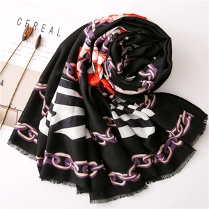 Elegant long scarf with purple chain and zebra print patterns on a minimalist background