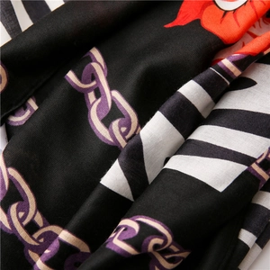 Macro detail of the zebra stripes and floral patterns on this long versatile scarf