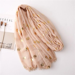 Detail of pink cotton linen scarf with gold foil elephant print and fringe edges