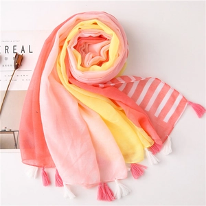 Detailed view of color-blocked cotton linen scarf with tassels and stripes for beach