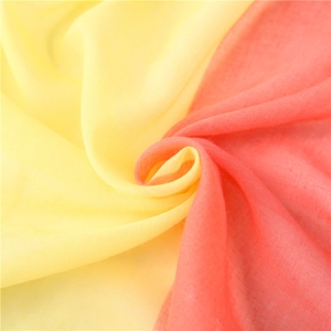 Lightweight cotton linen scarf in yellow and coral pink bicolor spiral display for beach
