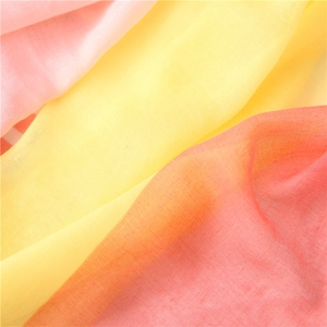 Detailed texture of yellow and pink cotton-linen blend fabric with breathable fiber weave