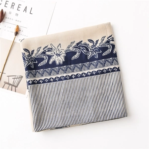 Detailed view of floral cotton-linen scarf with navy stripes and elegant botanic patterns
