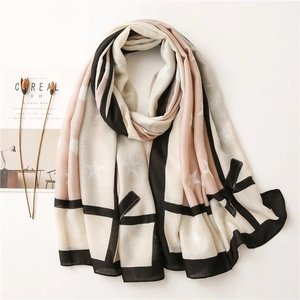 Women's scarf with bow, star and geometric patterns in black, pink, and beige