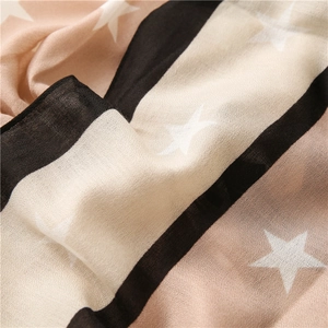 Detail of star print and stripe texture on soft breathable cotton-linen scarf fabric