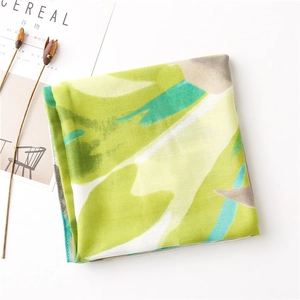 Detailed view of pink and green ink-wash cotton linen scarf with hand-rolled edges