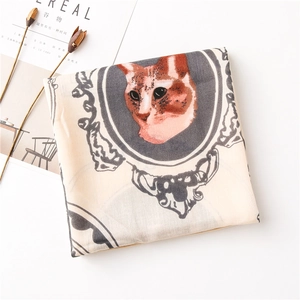 Detail of soft square scarf featuring a realistic cat print and vintage frame pattern