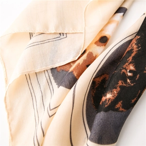 Detail of soft square scarf with cat animal print and delicate rolled edge finish