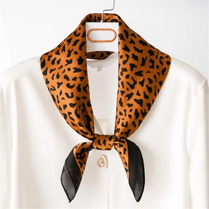 Classic leopard print silk square scarf styled on a white shirt collar for women