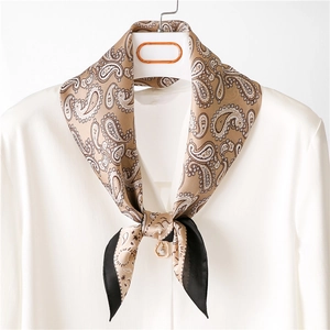 Elegant beige paisley silk scarf with heart pearl pendant on white shirt for women