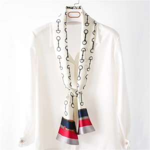Elegant white skinny silk scarf with black horsebit pattern and red navy stripe accents
