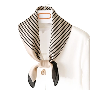 Nordic style champagne and black striped silk scarf worn with a white professional shirt