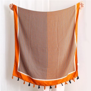 Orange and blue geometric diamond pattern linen-feel scarf with elegant tassels