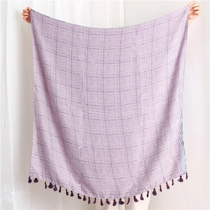 Detail of purple houndstooth cotton linen scarf with elegant fringe tassel edges