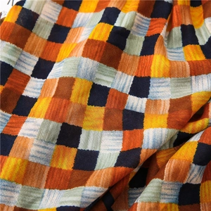 Detailed view of the crinkle texture and vibrant plaid pattern on this cotton linen scarf