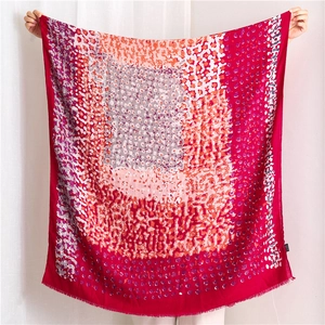 Detail of colorful oil painting style linen scarf featuring abstract polka dots and fringe