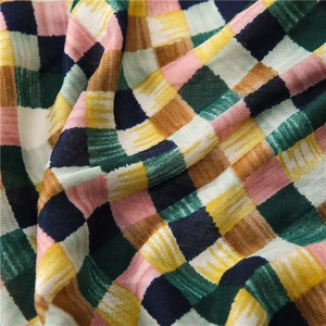 Macro detail of soft cotton-linen scarf fabric with colorful woven plaid pattern